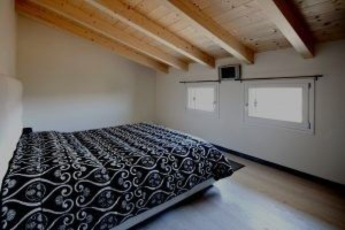 Case in legno RIKO-HISE srl - Arch. Daniele Bonzi Casa in pietra 